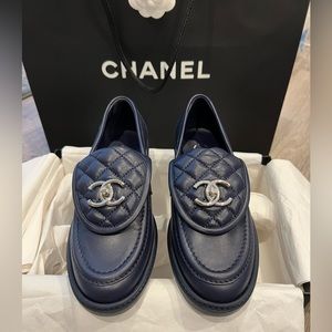 CHANEL turn lock lambskin Loafers